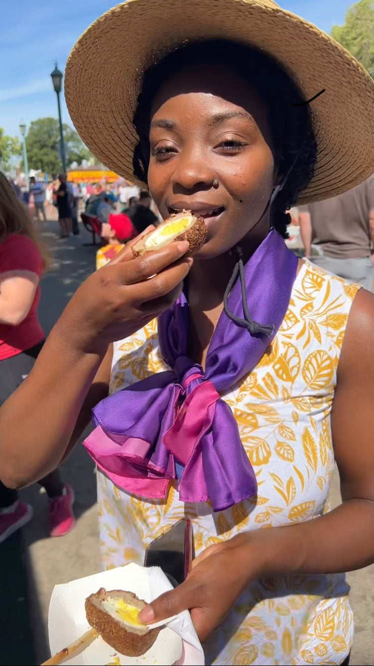 eating a Scotch egg at the Minnesota State Fair