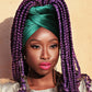 Photo shoot with purple braids and green head covering for Saint Patrick's Day