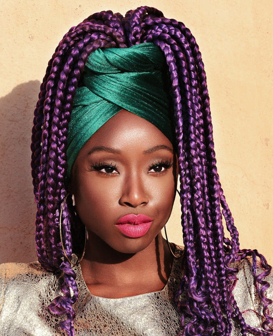 Photo shoot with purple braids and green head covering for Saint Patrick's Day